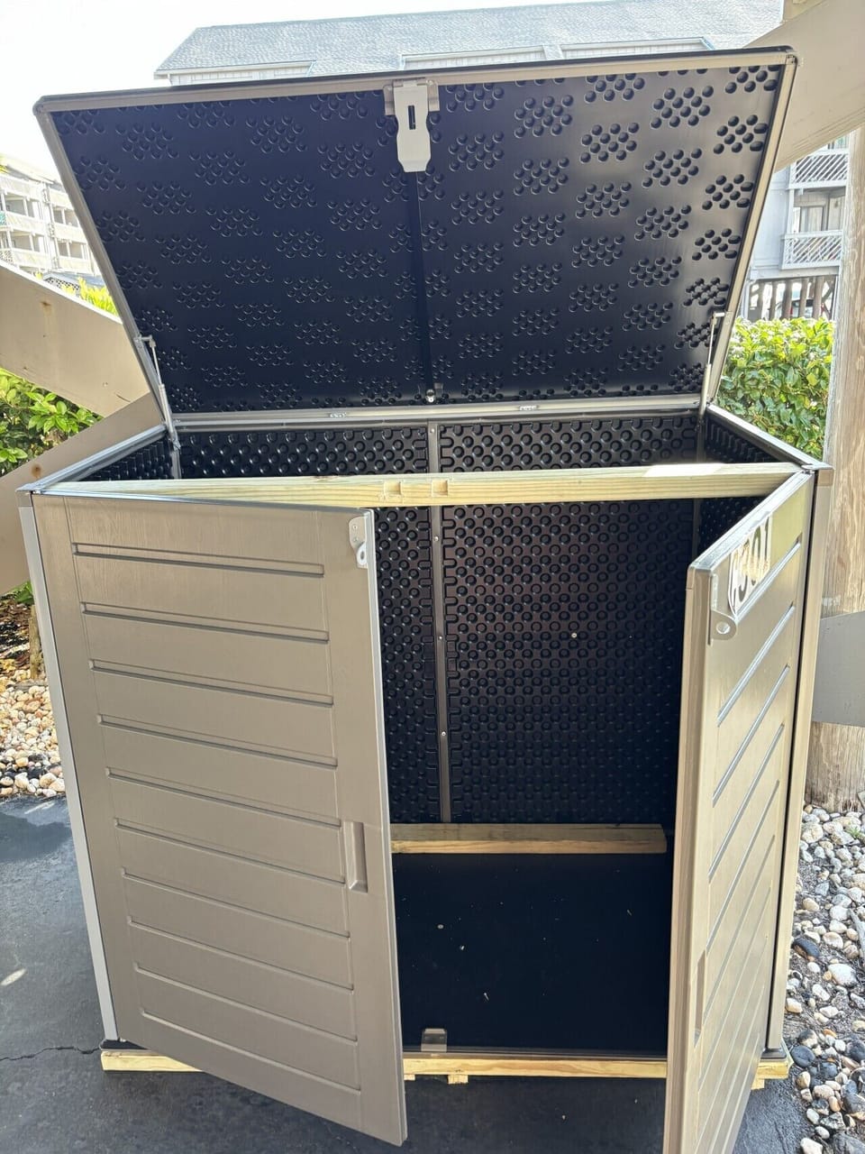 Filled with beach chairs and accessories, this convenient storage bin is located in the parking area for ease of taking to the beach.