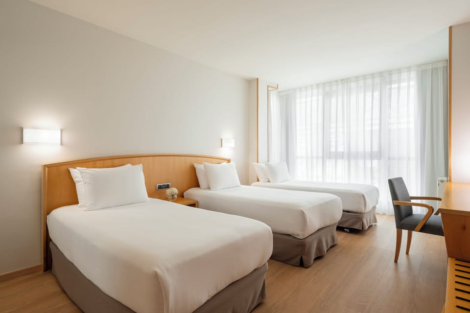 Triple Room | Minibar, desk, blackout drapes, free WiFi