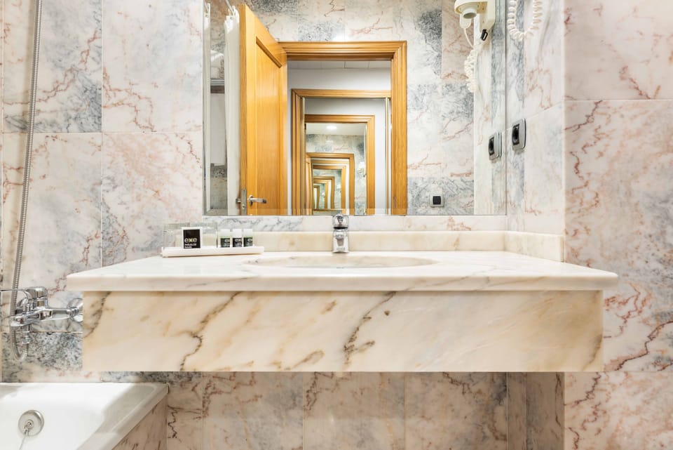 Quadruple Room | Bathroom | Bathtub, eco-friendly toiletries, hair dryer, towels