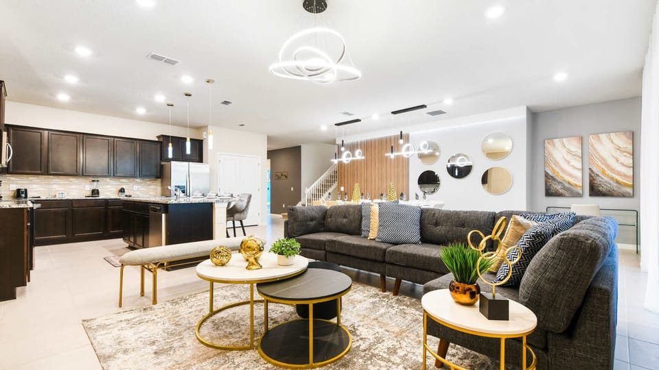 Spacious modern haven with designer kitchen, chic decor, and open social layout
