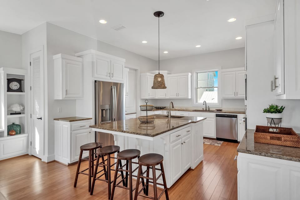 Oversized kitchen with gorgeous granite, spacious cabinets, stainless appliances, additional wet bar and island with extra seating (second level)