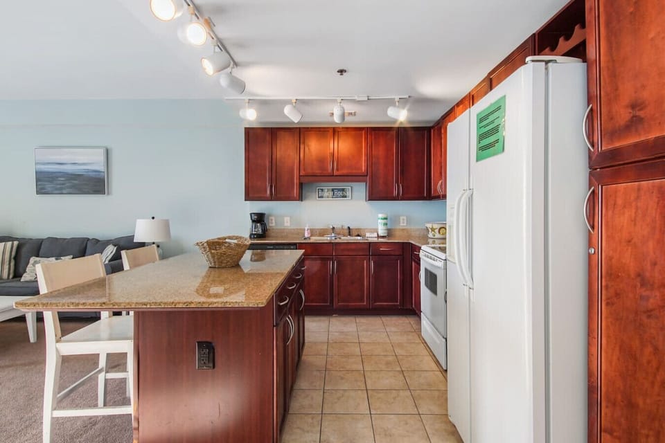 Fully stocked kitchen with island and seating for 2