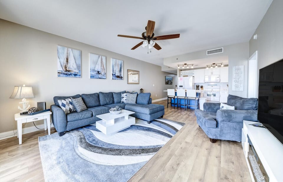 Spacious Living Area with Sleeper Sofa, Flat Screen TV, Ocean Views and Balcony Access