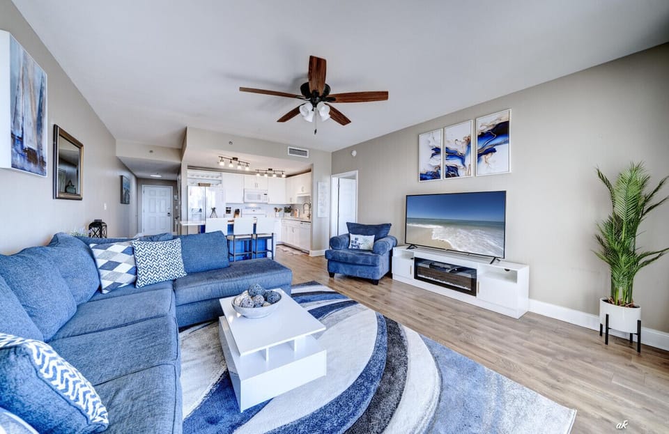 Spacious Living Area with Sleeper Sofa, Flat Screen TV, Ocean Views and Balcony Access