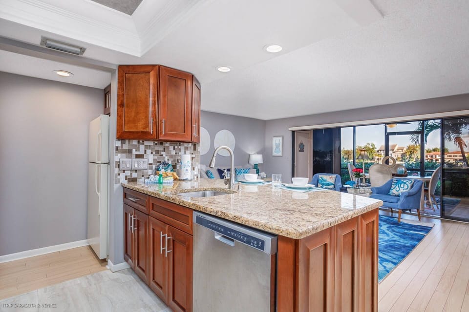 Open kitchen to the main area with stainless appliances and ample cabinet space