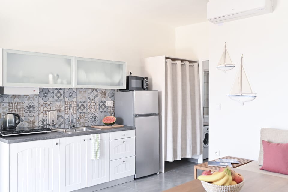 Sea View Apartment | Private kitchen | Full-size fridge, microwave, espresso maker, electric kettle