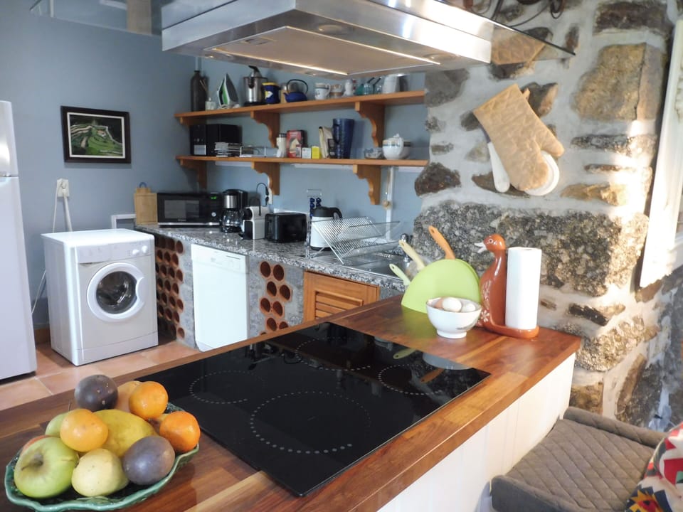 A well stocked kitchen, with Nespresso coffee machine.