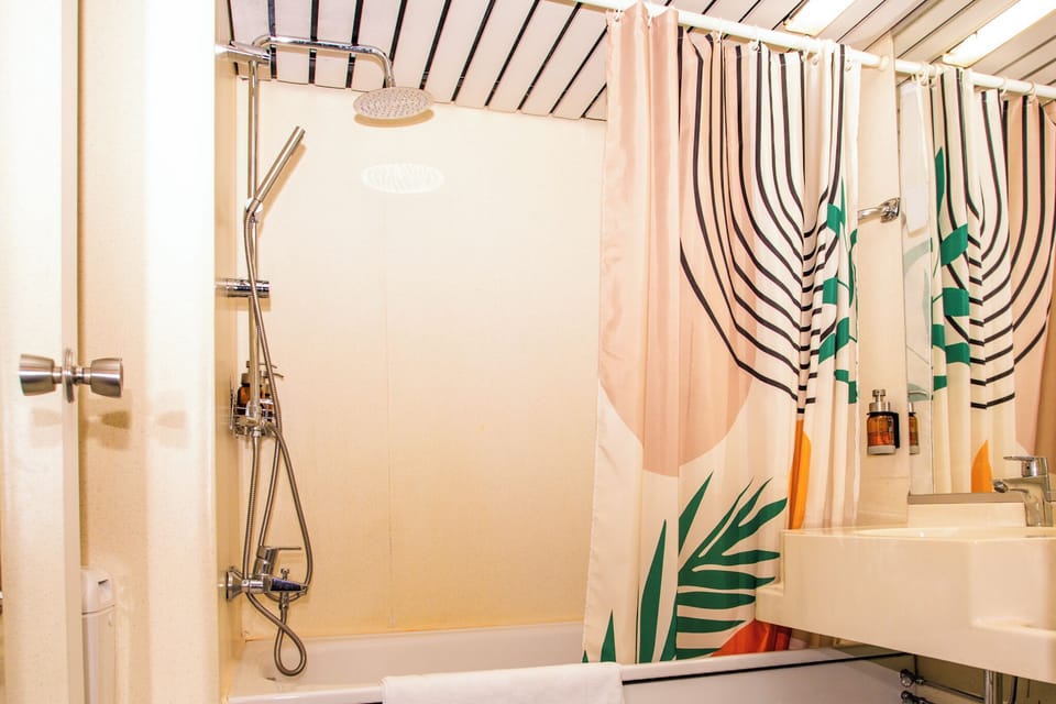 Rainfall showerhead, free toiletries, hair dryer, towels