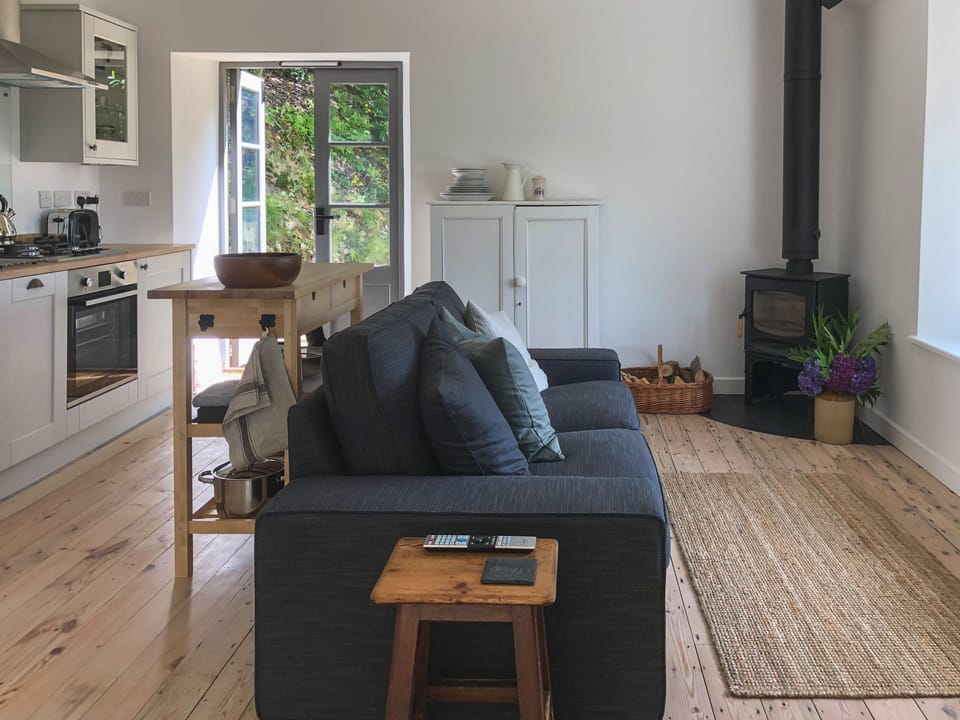 The living area with french doors onto roof terrace and back terrace