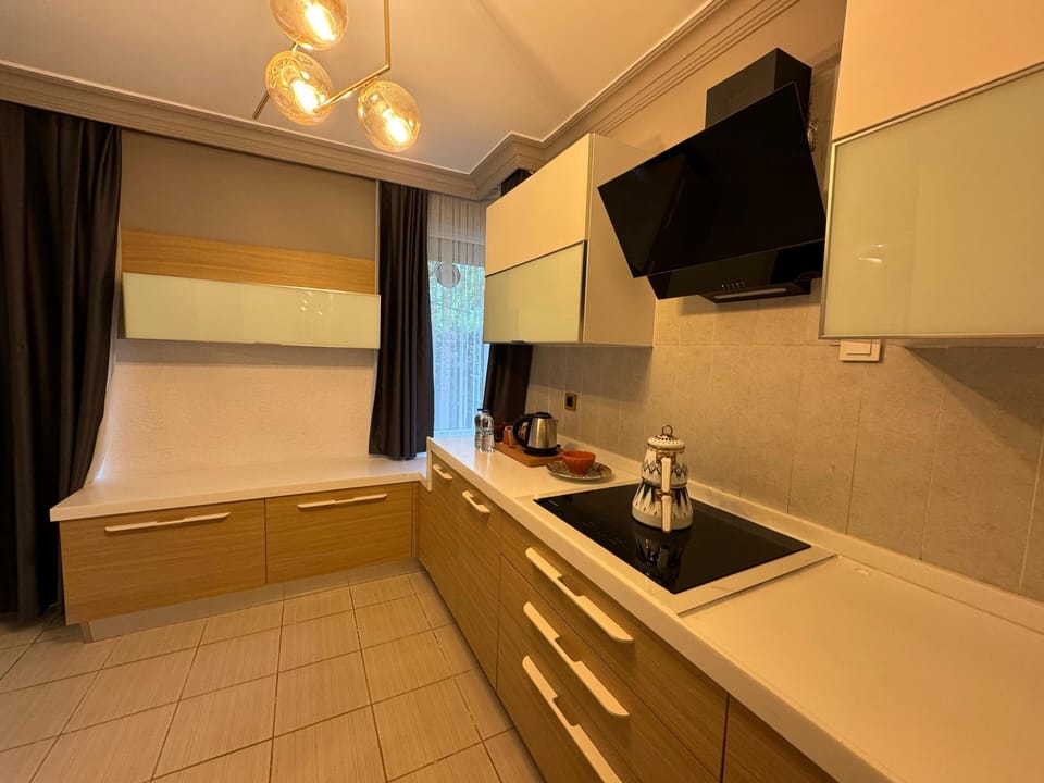 Family Room, Sea View | Private kitchen | Electric kettle, highchair