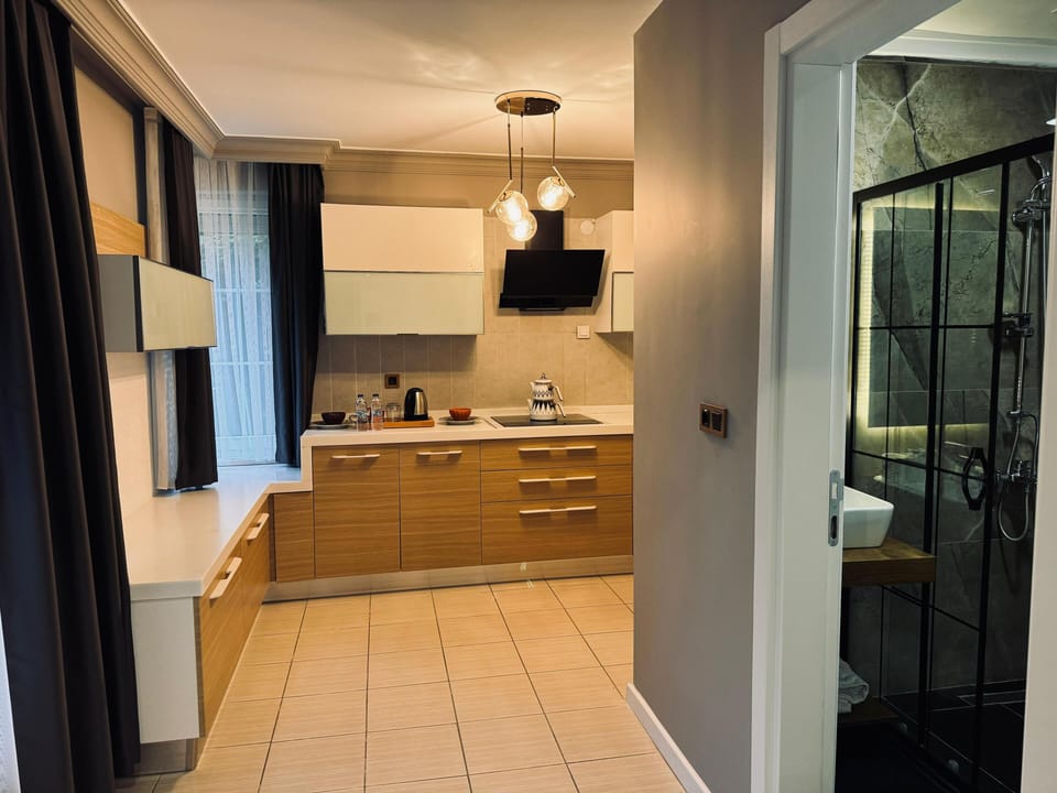 Family Room, Sea View | Private kitchen | Electric kettle, highchair