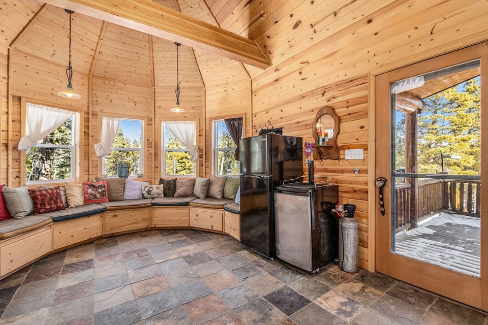 - Unique turret style nook with wraparound bench seating and towering windows