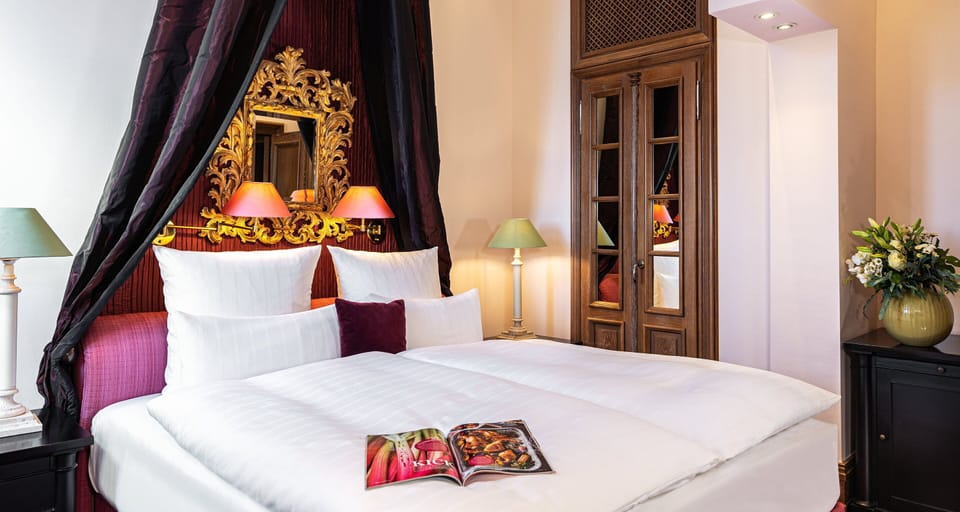 Hypo-allergenic bedding, down comforters, minibar, in-room safe