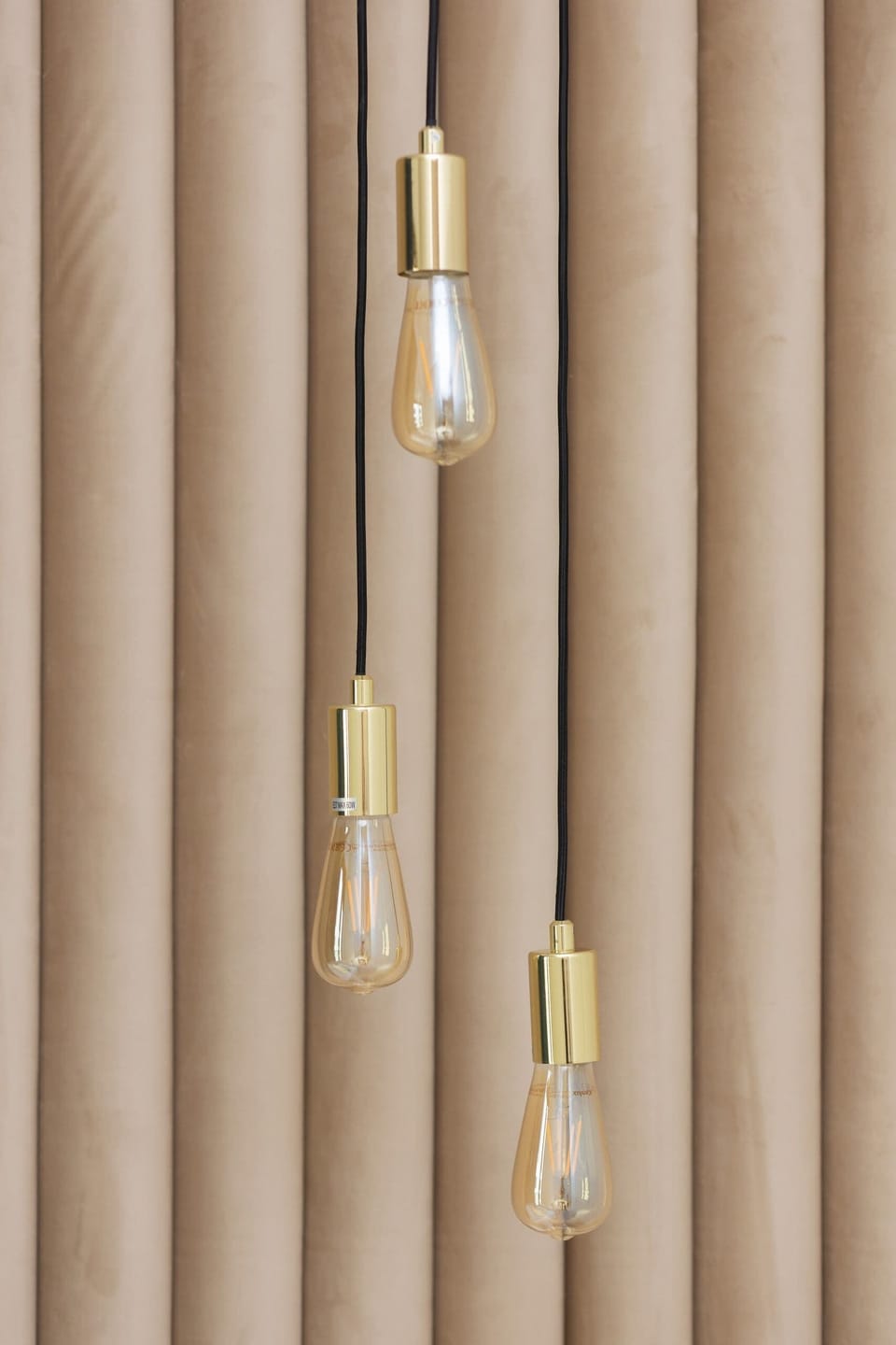 A detailed shot of luxurious curtains with golden decor elements.

