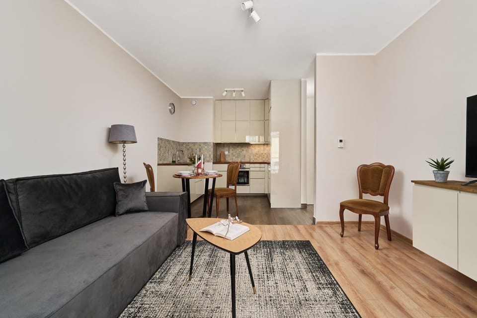 Open-plan living and dining area with a comfortable seating arrangement and stylish decor.

