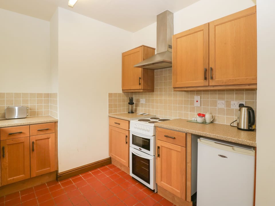Fridge, electric kettle, toaster, cookware/dishes/utensils