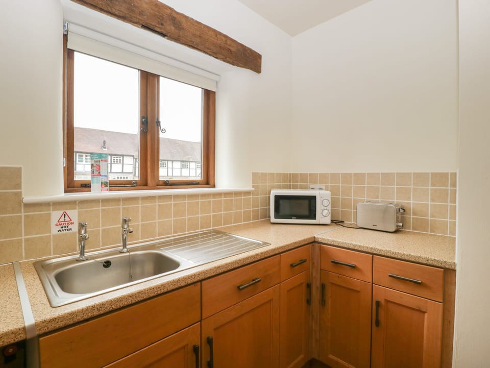 Fridge, electric kettle, toaster, cookware/dishes/utensils