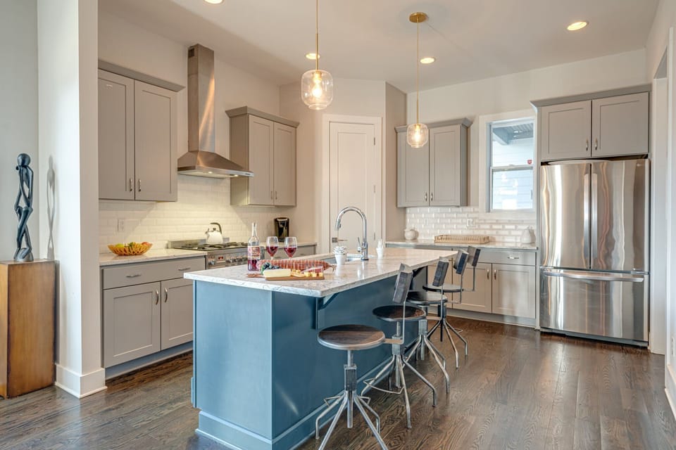Fully equipped kitchen stocked with your basic cooking essentials complete with breakfast bar seating.