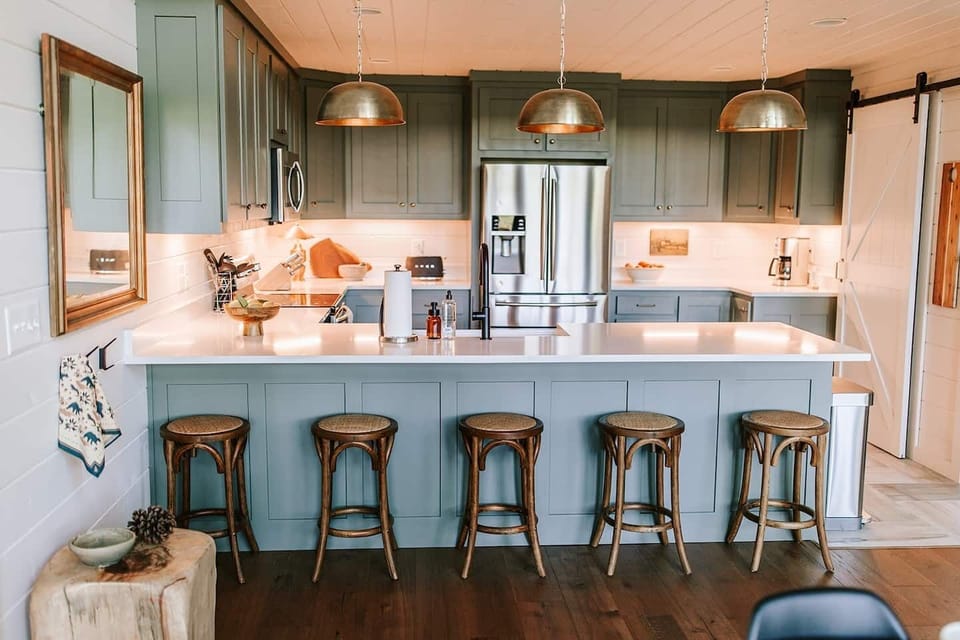 The state-of-the-art kitchen and dining area offer plenty of room to comfortably host family dinners and are outfitted with all the cookware, dishes, utensils, and appliances you will need to cook delicious meals. Bar top has seating for five. 