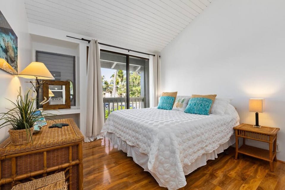 Cozy bedroom retreat w/ soft light & garden views.