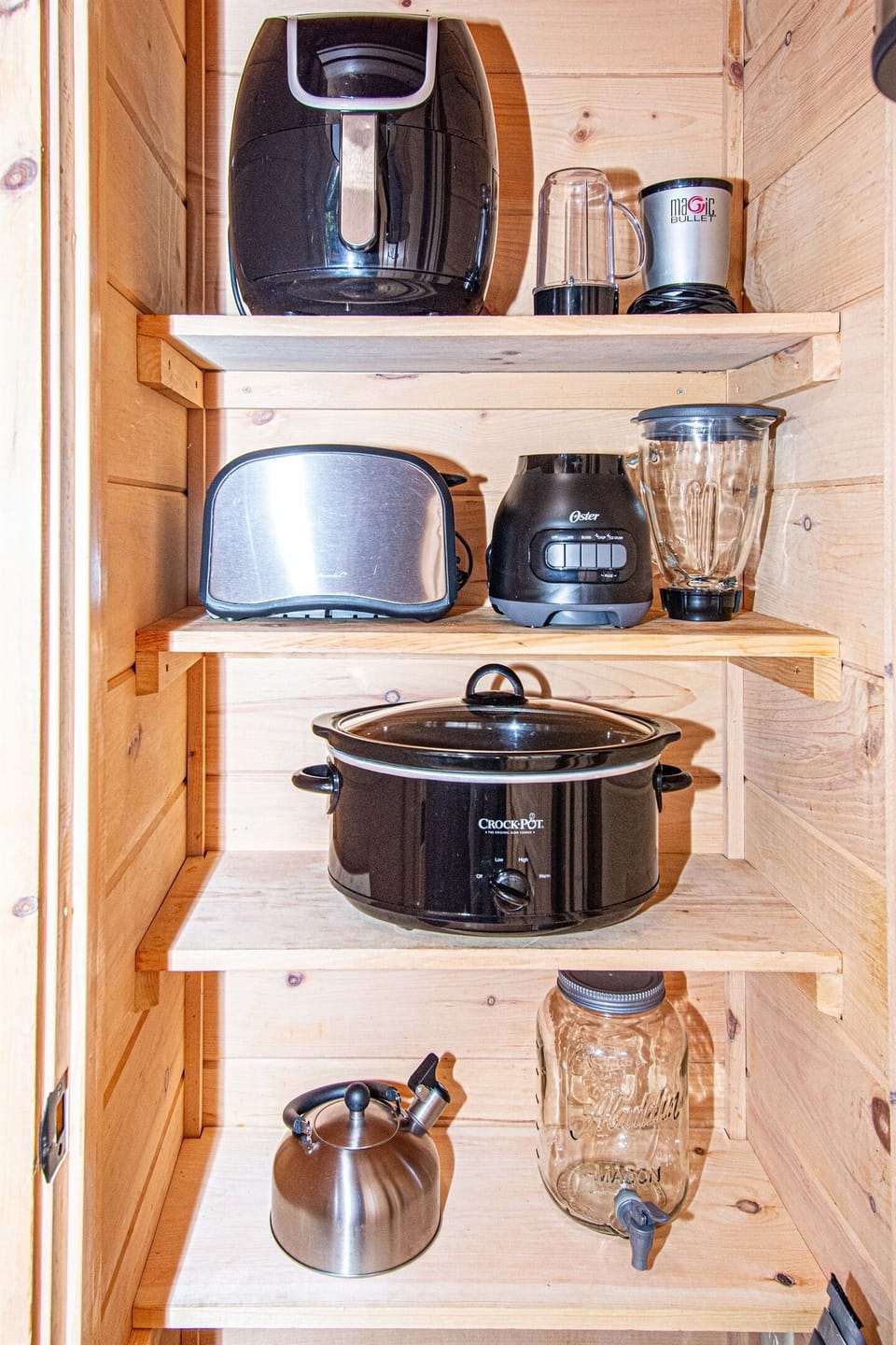 Appliances include: air fryer, magic bullet mixer, toaster, blender, crock pot, tea kettle, and hand mixer.