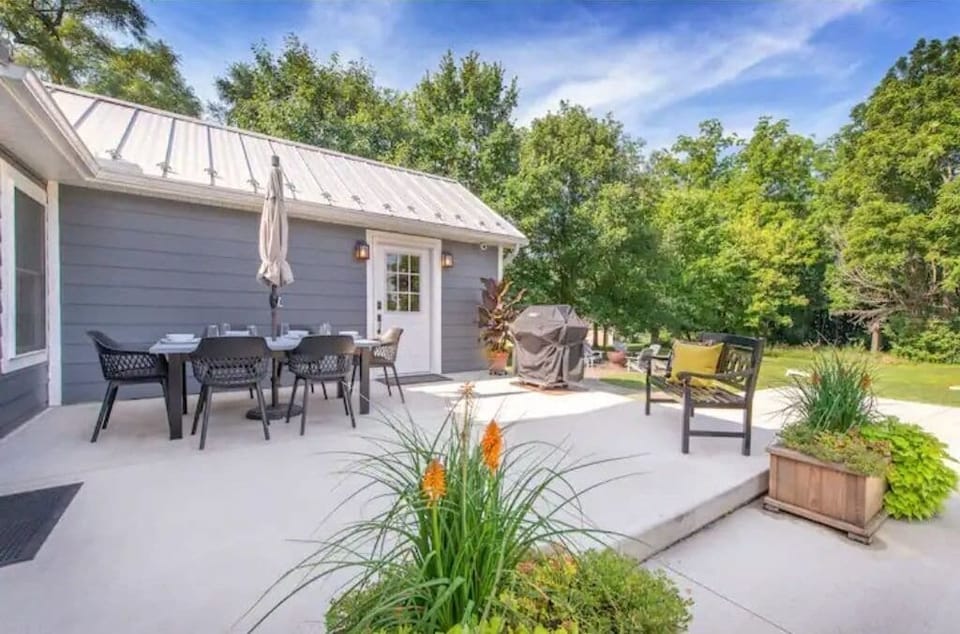 Back porch with gas grill. Access to house by smart lock located on door.
