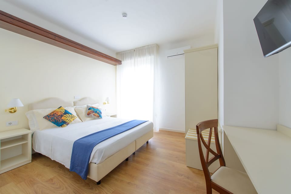 Classic Double or Twin Room | Minibar, in-room safe, desk, laptop workspace