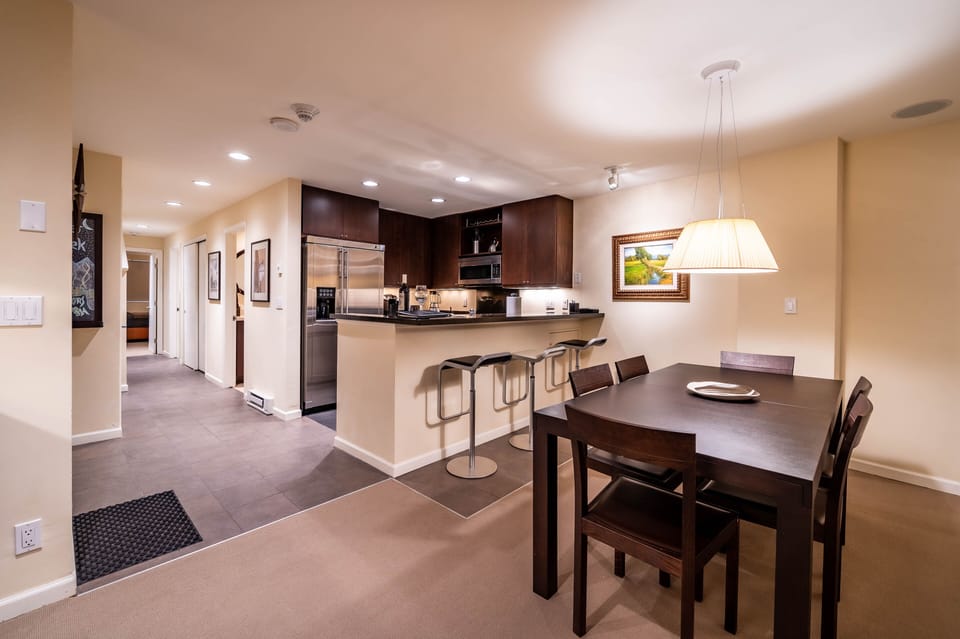 Open-concept plan for kitchen, dining and living areas makes gathering easy. 