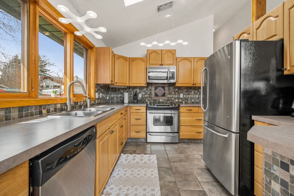 Full kitchen with a drip coffee maker, blender, ground coffee, tea, sugar and basic condiments (ketchup, mustard, relish.)