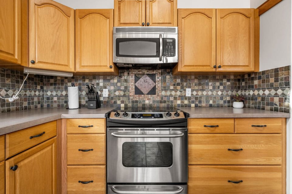 Full kitchen with a drip coffee maker, blender, ground coffee, tea, sugar and basic condiments (ketchup, mustard, relish.)