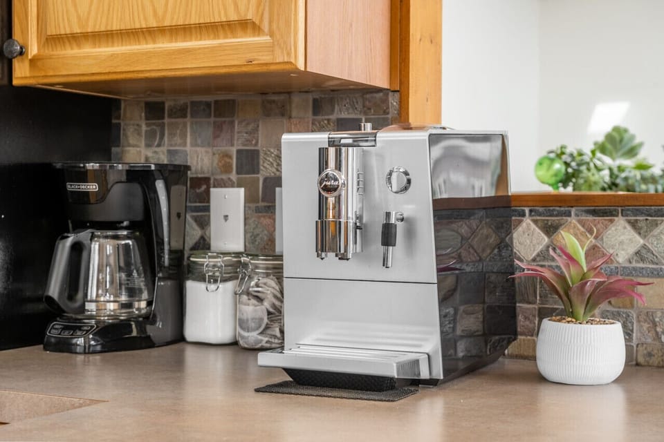 Full kitchen with a drip coffee maker, blender, ground coffee, tea, sugar and basic condiments (ketchup, mustard, relish.)