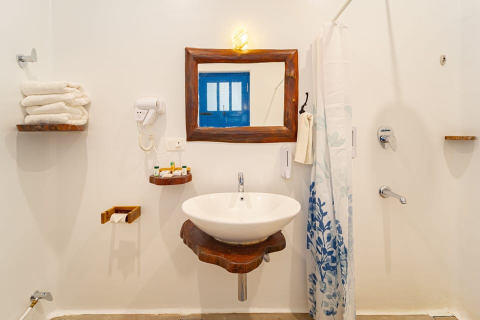 Deluxe Double Room, Patio, Pool View | Bathroom | Shower, hair dryer, slippers, soap