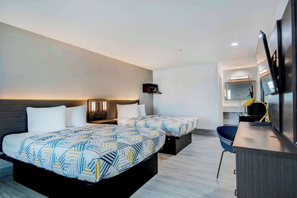 Desk, laptop workspace, free WiFi, bed sheets