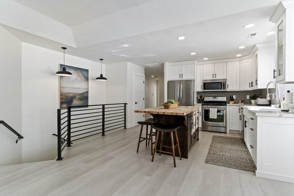 Kitchen and stairs to basement floor living area 