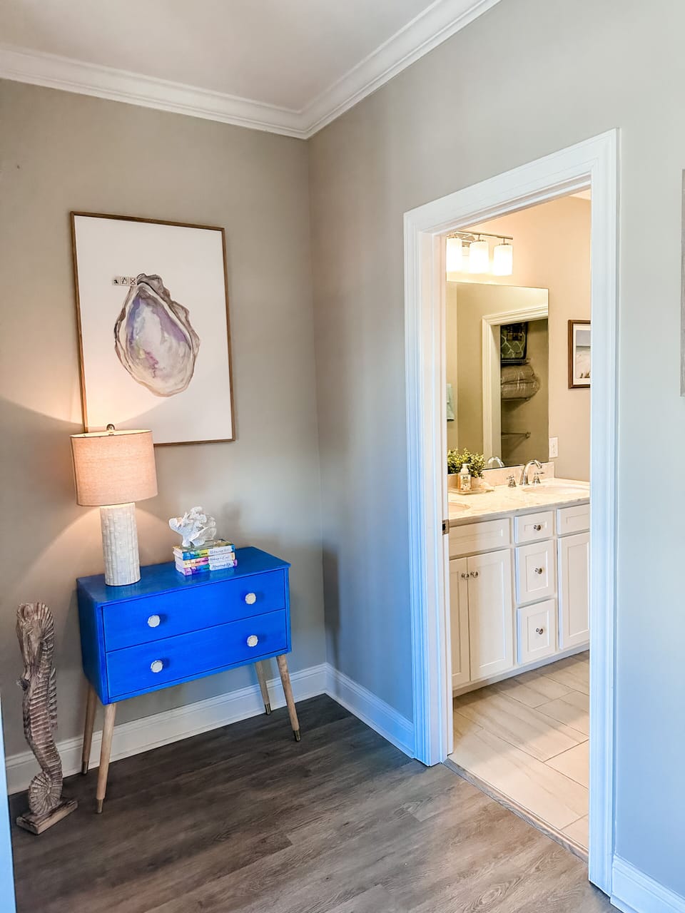 large attached bath with double sink, tub/shower and spacious walk in closet