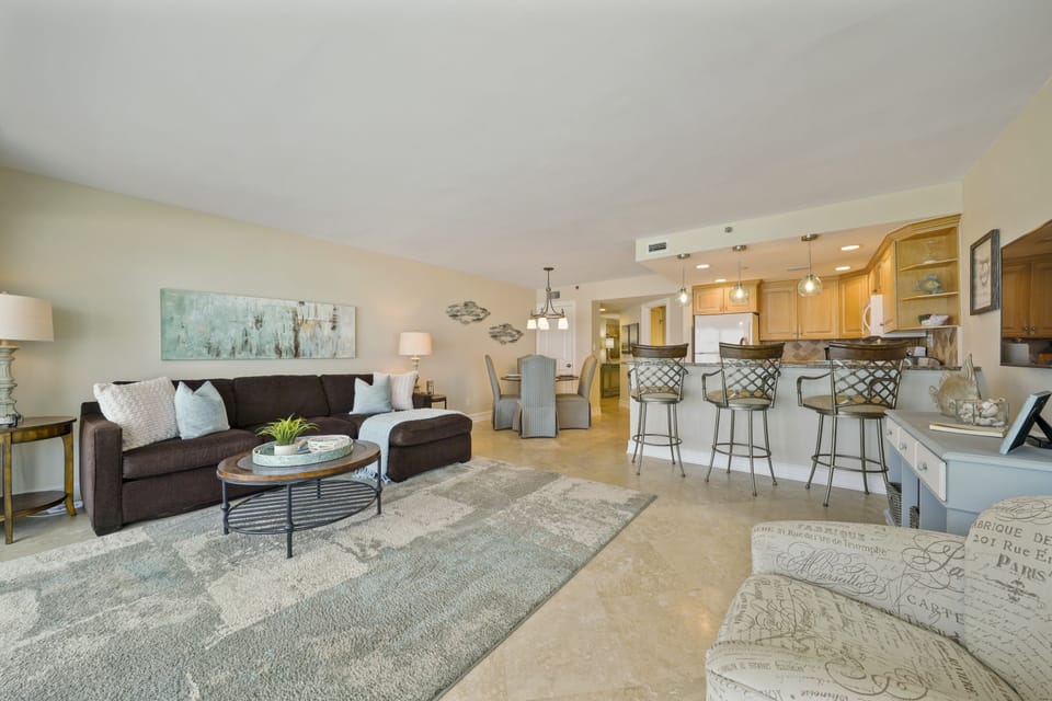 Unwind in this oceanfront condo with expansive balcony views, modern amenities, and a prime beachfront location.