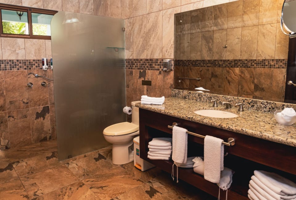 Shower, rainfall showerhead, designer toiletries, hair dryer