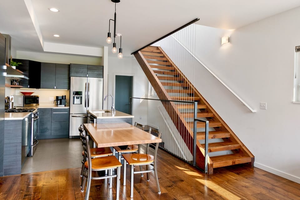Fabulous design. Reclaimed wood floors and stairs. Seat 5 at dining table. 