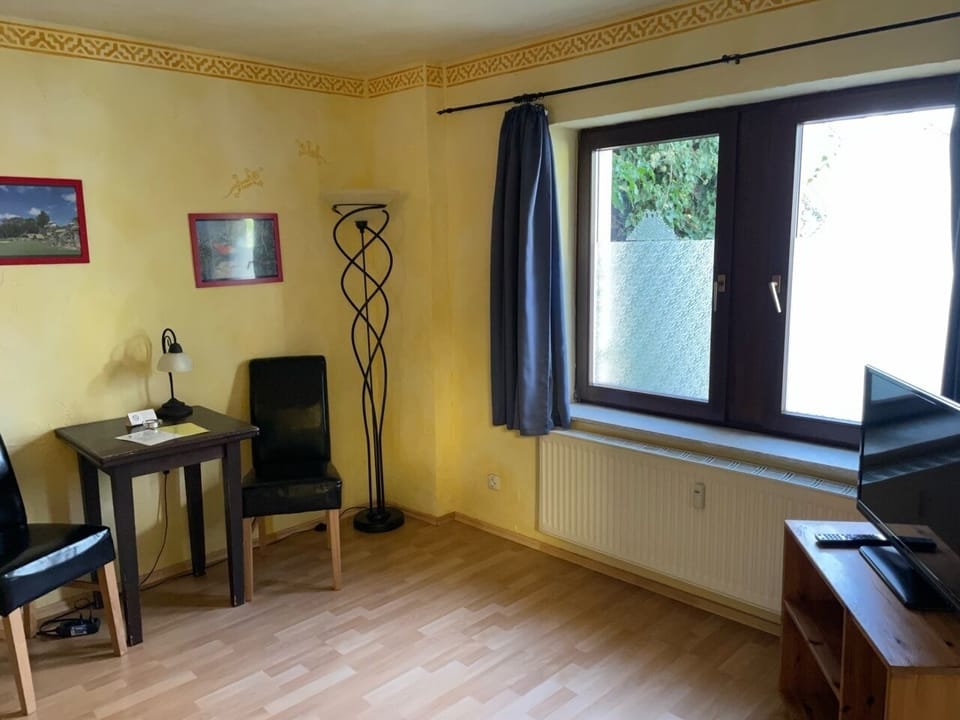 Apartment, 1 Queen Bed | Living area | Flat-screen TV