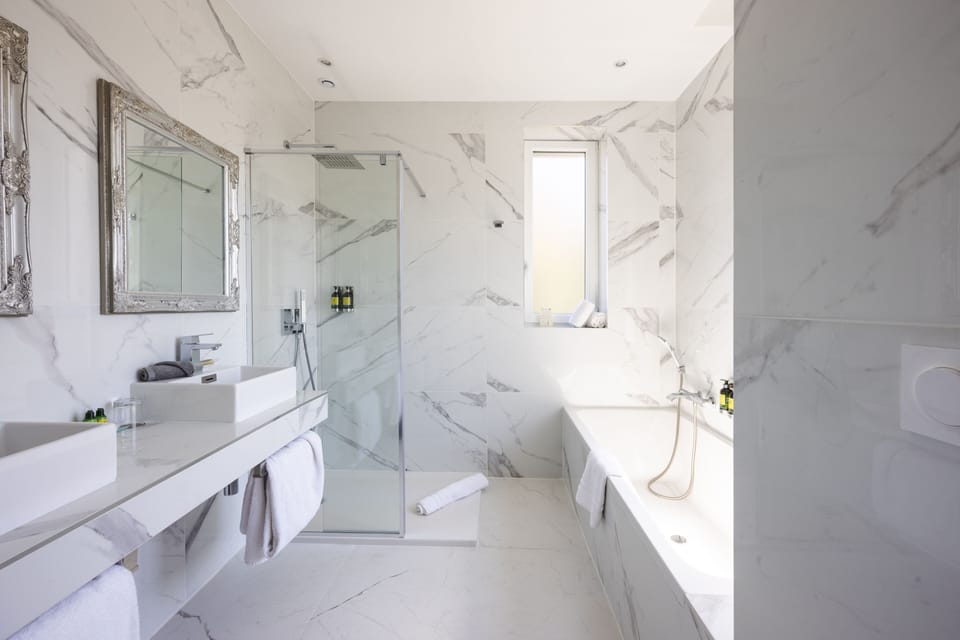 Junior Suite, Balcony | Bathroom | Hair dryer, bathrobes, slippers, towels