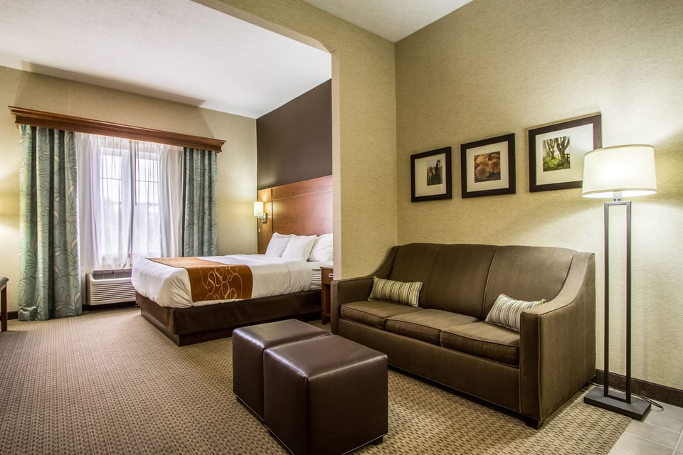 Premium bedding, laptop workspace, blackout drapes, soundproofing