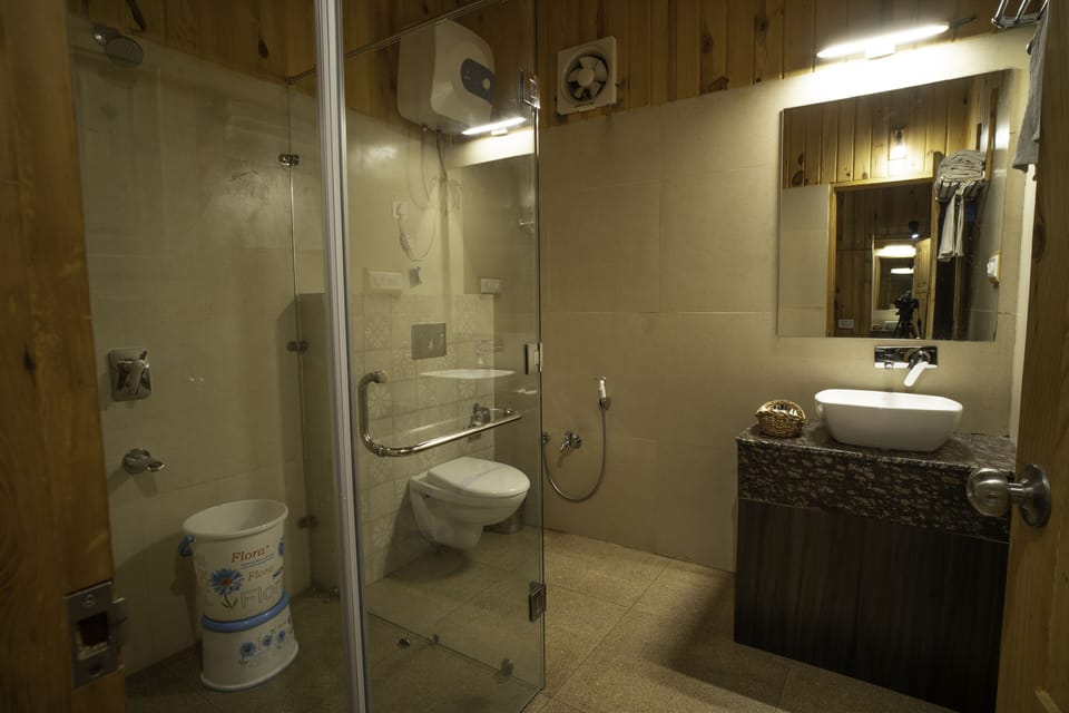 Family Room | Bathroom | Rainfall showerhead, designer toiletries, hair dryer, bathrobes