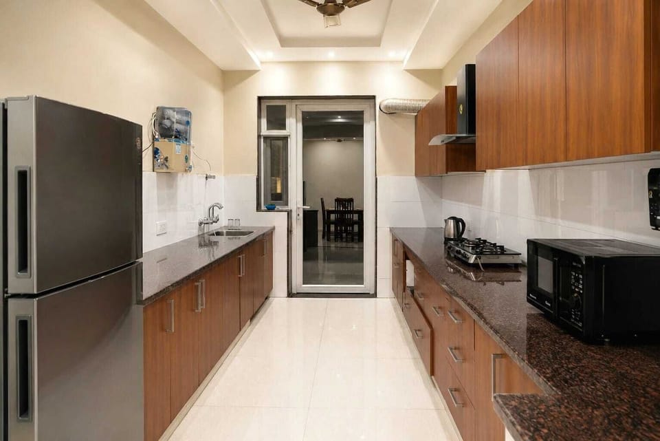 Luxury Triple Room | Private kitchen | Fridge, microwave
