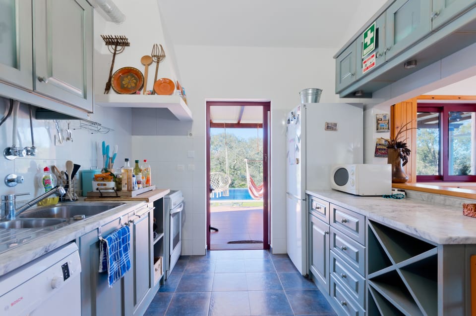 Access to balcony and swimming pool through kitchen.
