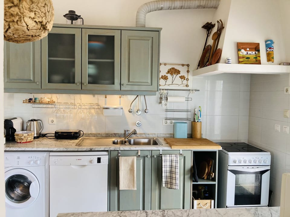 Fully equipped and comfortable kitchen, with amazing view to the pool.