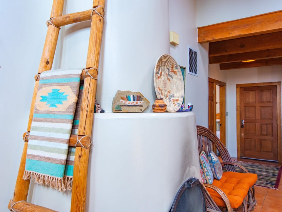 A wooden ladder in a living room.