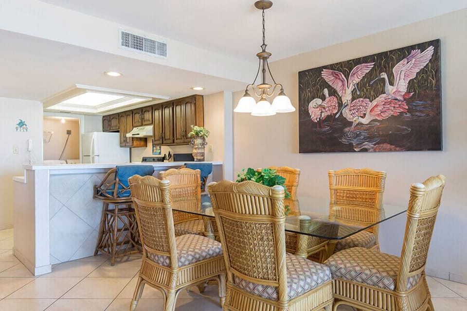 Our dining area fits 6 at the table and 2 more at the breakfast bar. Entertaining and meal times are a breeze with this much space!