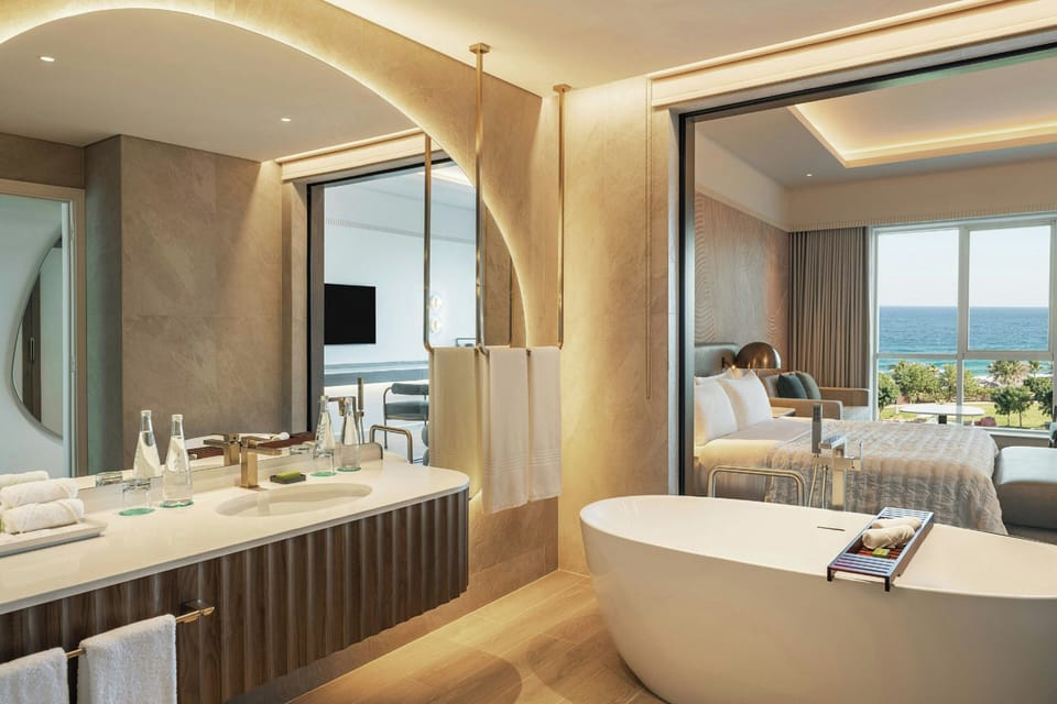 Separate tub and shower, designer toiletries, hair dryer, bathrobes