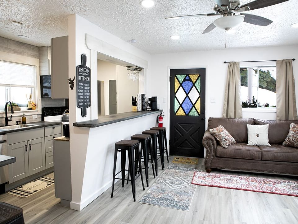 Upstairs - A photo of the upstairs den, kitchen and entryway.