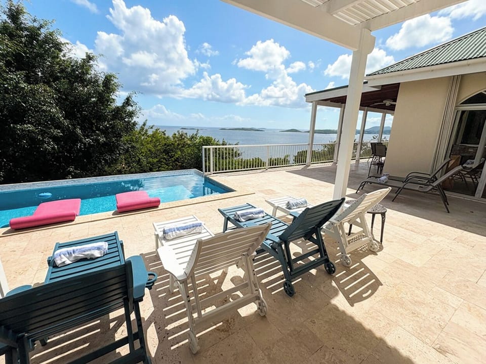 The sliding glass door from the left bedroom opens on to the pool and sundeck